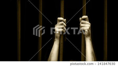 Sad young girl in prison Sad young girl in prison 141847630