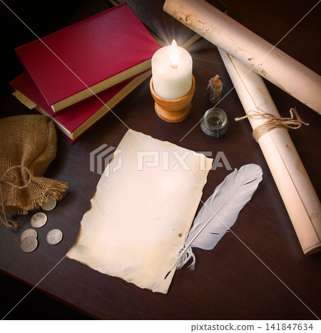 Paper and quill on the table Paper and quill on the table 141847634