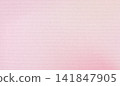 Pink textured paper providing a versatile background for packaging design, cosmetic branding, and elegant stationery, featuring natural cotton fibers and ample copy space 141847905