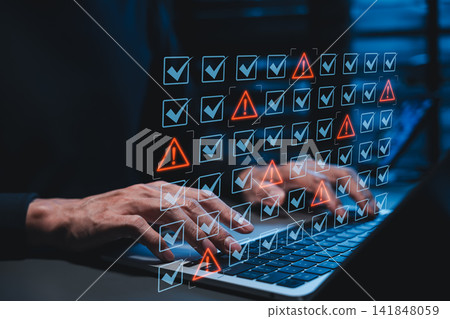 Cyber security risk compliance audit and digital data vulnerability warning alert system concept. developer typing on laptop computer to detect software errors, information leaks, data error detection Cyber security risk compliance audit and digital data vulnerability warning alert system concept. developer typing on laptop computer to detect software errors, information leaks, data error detection 141848059