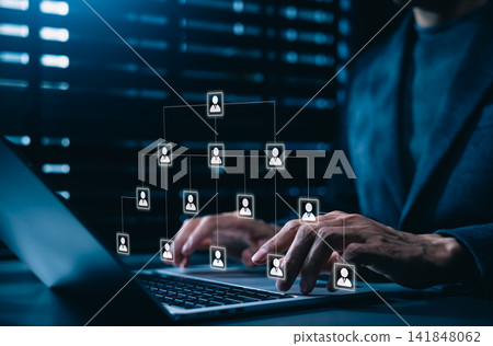 Corporate hierarchy chart and human resources structure concept. Business manager using laptop with corporate organizational scheme with people profile icons, digital team delegation network workflow. Corporate hierarchy chart and human resources structure concept. Business manager using laptop with corporate organizational scheme with people profile icons, digital team delegation network workflow. 141848062