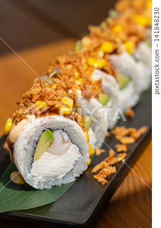 Close-up of sushi rolls with shrimp, avocado and cream cheese Close-up of sushi rolls with shrimp, avocado and cream cheese 141848230