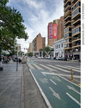 Cordoba, Argentina - April 13, 2026: Wide avenue with protected bicycle lane in central Cordoba Cordoba, Argentina - April 13, 2026: Wide avenue with protected bicycle lane in central Cordoba 141848860