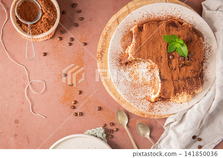 Top view of homemade traditional tiramisu cake Top view of homemade traditional tiramisu cake 141850036