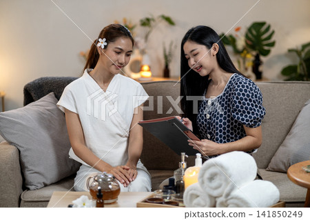 Asian adult women discuss wellness plan professional therapist give consultation relaxation therapy holistic health beauty treatment 141850249