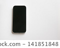 A brand new smartphone placed against a white background. 141851848