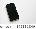 A brand new smartphone placed against a white background. 141851849