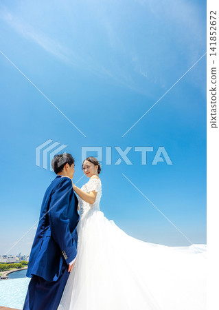 The bride and groom under the blue sky The bride and groom under the blue sky 141852672