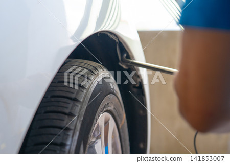 Removing dents on the car. PDR technology. Car body repair without painting. Removing dents on the car. PDR technology. Car body repair without painting. 141853007