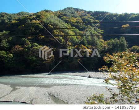 Autumn mountains and rivers adorned with colorful foliage. Autumn mountains and rivers adorned with colorful foliage. 141853786