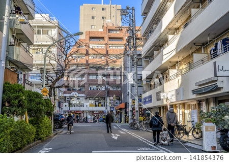 Urban landscape of Ota Ward, Tokyo: Streetscape and shops in front of Ikegami Station Urban landscape of Ota Ward, Tokyo: Streetscape and shops in front of Ikegami Station 141854376