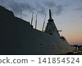Destroyer in the harbor at dawn 141854524
