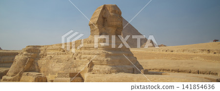 Great Sphinx with Khafre Pyramid in Giza, panoramic Egyptian desert landscape with copy space Great Sphinx with Khafre Pyramid in Giza, panoramic Egyptian desert landscape with copy space 141854636