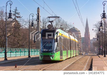 Modern Tram Crossing Historic Bridge in Poznan Poland Modern Tram Crossing Historic Bridge in Poznan Poland 141854771
