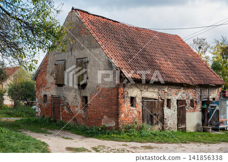 Old brick house with weathered facade in Gvardeysk, Russia Old brick house with weathered facade in Gvardeysk, Russia 141856338