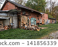 Old red brick outbuilding in a Russian village 141856339