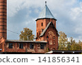 Historic red brick tower of former psychiatric hospital in Gvardeysk, Kaliningrad Oblast. Russia 141856341