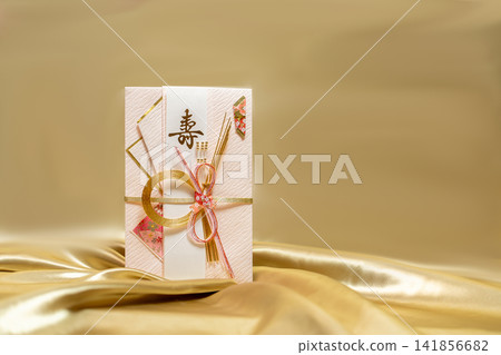 A beautiful celebratory envelope with a gold cloth backing, featuring a lovely mizuhiki (decorative cord). A beautiful celebratory envelope with a gold cloth backing, featuring a lovely mizuhiki (decorative cord). 141856682