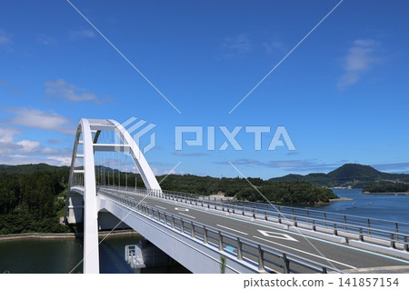 The magnificent exterior of Kesennuma Oshima Bridge, shining brightly on a clear day. The magnificent exterior of Kesennuma Oshima Bridge, shining brightly on a clear day. 141857154
