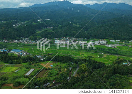 Aerial photograph showing a rural settlement from directly above. Aerial photograph showing a rural settlement from directly above. 141857324