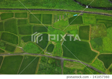 An aerial photograph showing a farming village in Kurabuchi, Takasaki City, Gunma Prefecture, viewed from directly above. 141857360