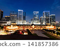 Night view of Tokyo Station. It's a major inter-city rail terminal in Chiyoda, Tokyo, Japan, with the Marunouchi and Yaesu high-rise business buildings in view.  141857386