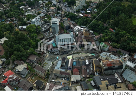 An aerial photograph showing a diagonal view of the Kusatsu Onsen hot spring resort town in Gunma Prefecture. An aerial photograph showing a diagonal view of the Kusatsu Onsen hot spring resort town in Gunma Prefecture. 141857462