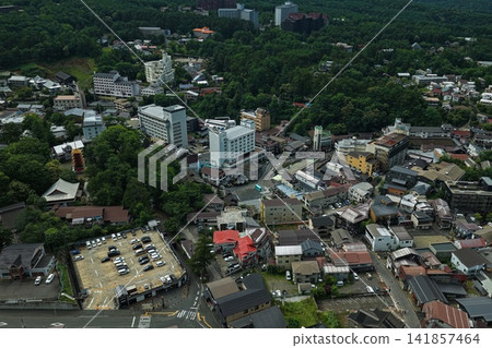 An aerial photograph capturing the hot spring town and pagoda of Kusatsu, Gunma Prefecture. An aerial photograph capturing the hot spring town and pagoda of Kusatsu, Gunma Prefecture. 141857464