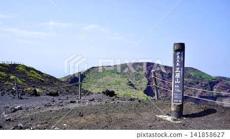 A signpost at the summit of Mt. Mihara on Izu Oshima Island in the Izu Islands of Tokyo, and a magnificent view of the crater. A signpost at the summit of Mt. Mihara on Izu Oshima Island in the Izu Islands of Tokyo, and a magnificent view of the crater. 141858627