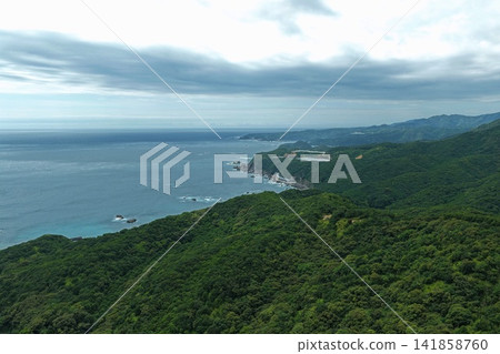 Aerial photograph capturing the cape, cliffs, and forested coastline of Susami Town, Wakayama Prefecture. Aerial photograph capturing the cape, cliffs, and forested coastline of Susami Town, Wakayama Prefecture. 141858760