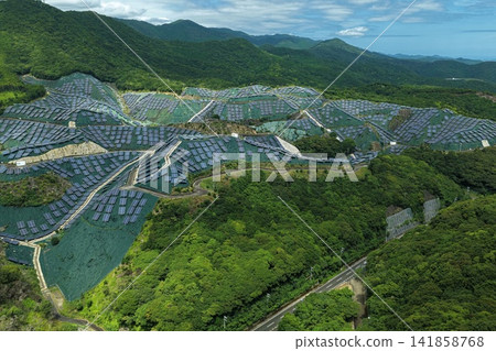 Aerial photograph of a mega solar power plant in the mountainous area of Susami Town, Wakayama Prefecture. 141858768