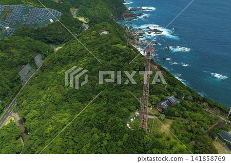 Aerial photograph capturing the coastline and solar panels of Susami Town, Wakayama Prefecture. 141858769