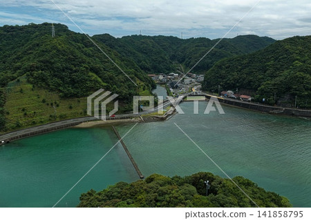 Aerial photograph capturing the inlet and bridge in Taiji Town, Wakayama Prefecture. Aerial photograph capturing the inlet and bridge in Taiji Town, Wakayama Prefecture. 141858795