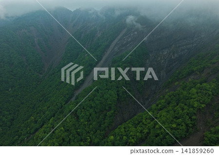 Aerial photograph capturing the mountainside and valley of Otani-kuzure in Shizuoka Prefecture. Aerial photograph capturing the mountainside and valley of Otani-kuzure in Shizuoka Prefecture. 141859260