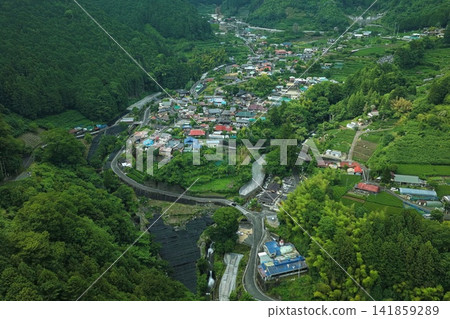 Aerial photograph overlooking the tea plantations and terraced rice fields of the Utogi settlement in Shizuoka City, Shizuoka Prefecture. Aerial photograph overlooking the tea plantations and terraced rice fields of the Utogi settlement in Shizuoka City, Shizuoka Prefecture. 141859289