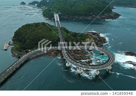 An aerial photograph capturing a spiral road bridge and island in Kushimoto Town, Wakayama Prefecture. An aerial photograph capturing a spiral road bridge and island in Kushimoto Town, Wakayama Prefecture. 141859348
