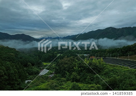 An aerial photograph capturing the morning sea of clouds and mountain range at Fuden Pass in Mihama Town, Mie Prefecture. An aerial photograph capturing the morning sea of clouds and mountain range at Fuden Pass in Mihama Town, Mie Prefecture. 141859385