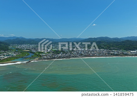 Aerial photograph capturing the coastline and residential area of Minabe Town, Wakayama Prefecture. Aerial photograph capturing the coastline and residential area of Minabe Town, Wakayama Prefecture. 141859475