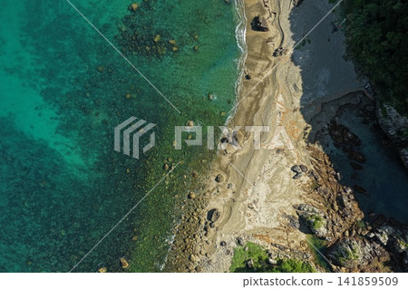 An aerial photograph capturing the coastline of Kushimoto Town, Wakayama Prefecture, with its rocky reefs and sandy beaches. An aerial photograph capturing the coastline of Kushimoto Town, Wakayama Prefecture, with its rocky reefs and sandy beaches. 141859509