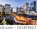 Night view of Tokyo Station. It's a major inter-city rail terminal in Chiyoda, Tokyo, Japan, with the Marunouchi and Yaesu high-rise business buildings in view.  141859623