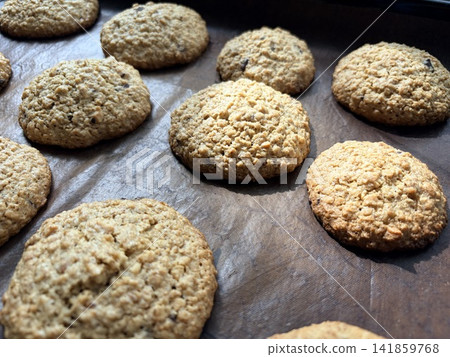 Homemade cookie. Freshly baked oatmeal cookies on a baking sheet Homemade cookie. Freshly baked oatmeal cookies on a baking sheet 141859768