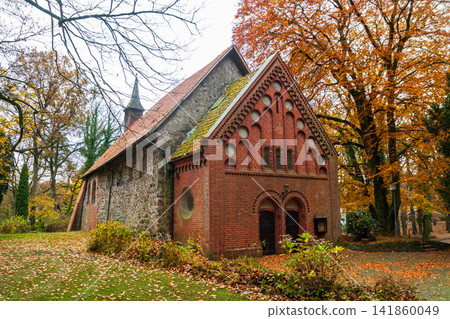 Historic Sinstorf Church in Hamburg Harburg surrounded by autumn foliage. Oldest building in Hamburg, Germany Historic Sinstorf Church in Hamburg Harburg surrounded by autumn foliage. Oldest building in Hamburg, Germany 141860049