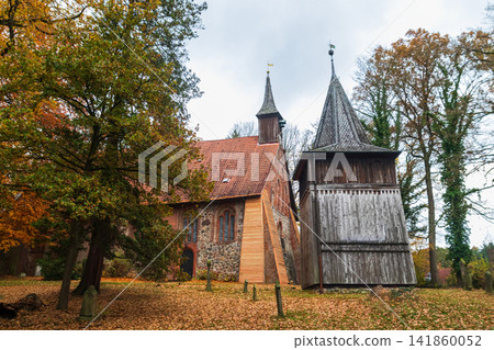 Historic Sinstorf Church in Hamburg Harburg surrounded by autumn foliage. Oldest building in Hamburg, Germany Historic Sinstorf Church in Hamburg Harburg surrounded by autumn foliage. Oldest building in Hamburg, Germany 141860052