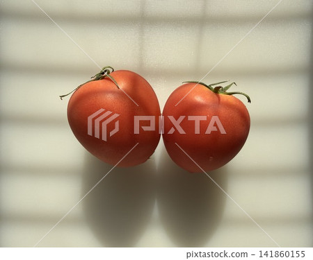 A bright red, heart-shaped tomato A bright red, heart-shaped tomato 141860155