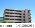 Apartment building under a blue sky 141860261