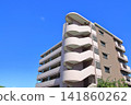 Apartment building under a blue sky 141860262