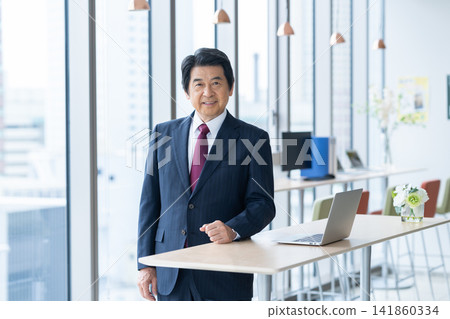 Executive businessmen working in an office. Filming assistance provided by: Denpa Gakuen Educational Foundation, Tokyo Electronics College. 141860334