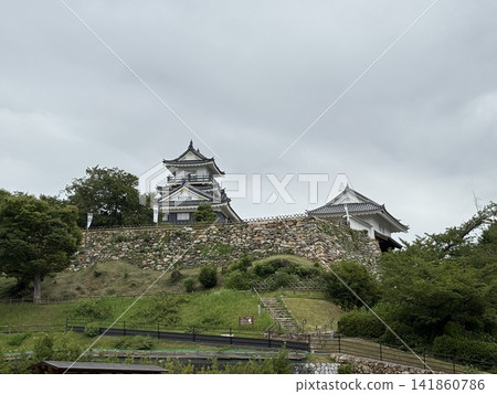 Hamamatsu Castle's keep stands tall atop a stone wall. Hamamatsu Castle's keep stands tall atop a stone wall. 141860786