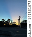 sunset over a residential area 141861078