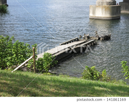 The remains of a pier (wharf) in Daiba Park (Third Daiba) in Minato Ward, Tokyo. The remains of a pier (wharf) in Daiba Park (Third Daiba) in Minato Ward, Tokyo. 141861169